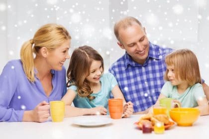 18916264 happy family with two kids having breakfast scaled