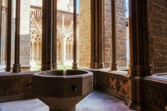 holy water stoup ornate gothic cloister arcade arches pamplona catedral