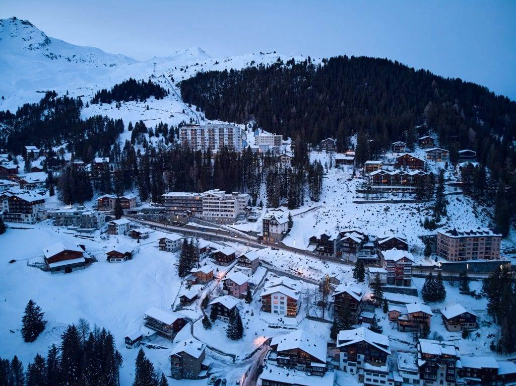Buildings on a Mountain covered in Snow during Winter